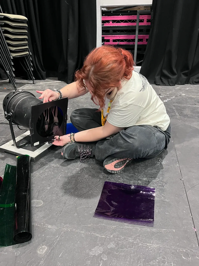 Student working backstage theatre