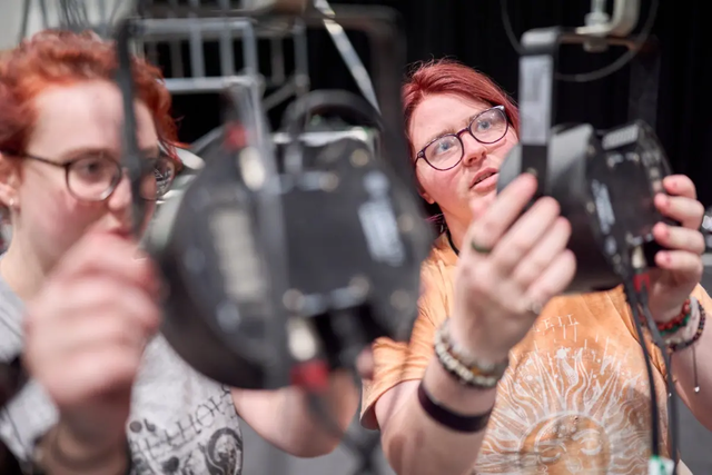 Students setting up microphones