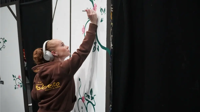 Student painting stage prop