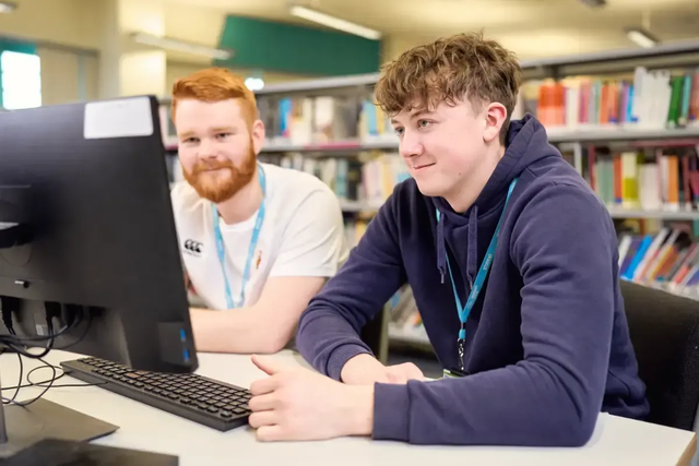 Male student and tutor in LRC