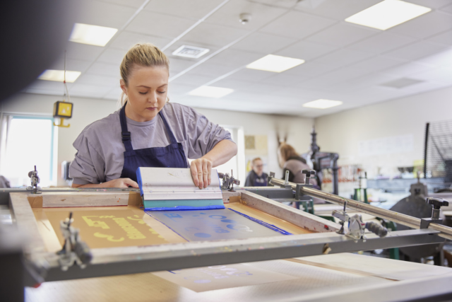 A student creates a print Printmaking