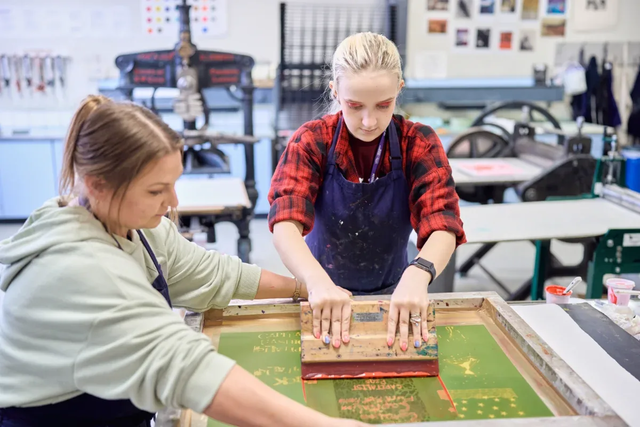 Graphic Design degree students working on projects in class 3