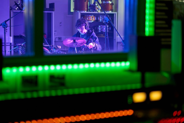 A student drums Digital Music Production
