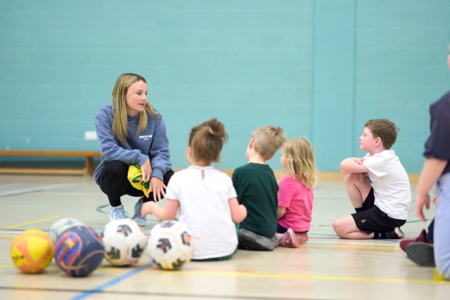 Sports coaching student taking a childrens PE lesson